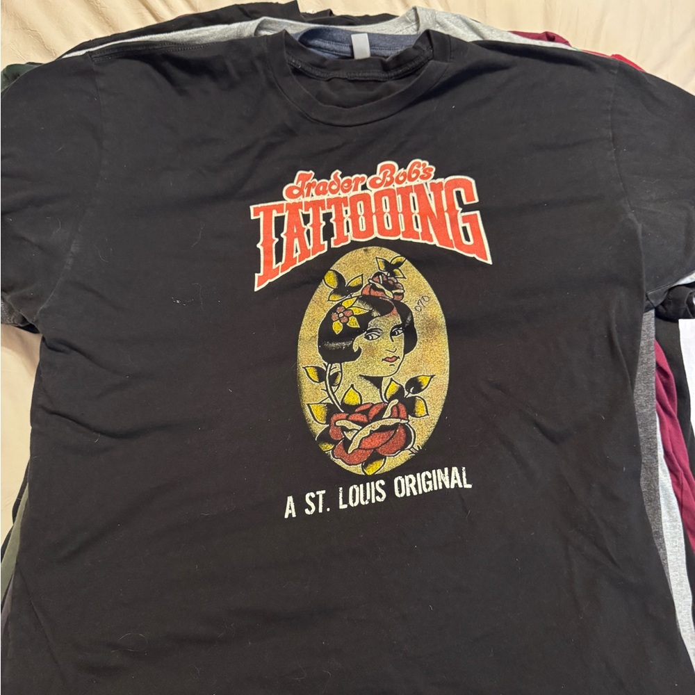 Next Level Apparel Black Graphic Tee with Red and Yellow Accents
